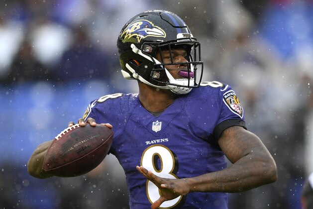 Baltimore Ravens quarterback Lamar Jackson throws to a receiver in the first half of an NFL football game against the Tampa Bay Buccaneers, Sunday, Dec. 16, 2018, in Baltimore. (AP Photo/Nick Wass)