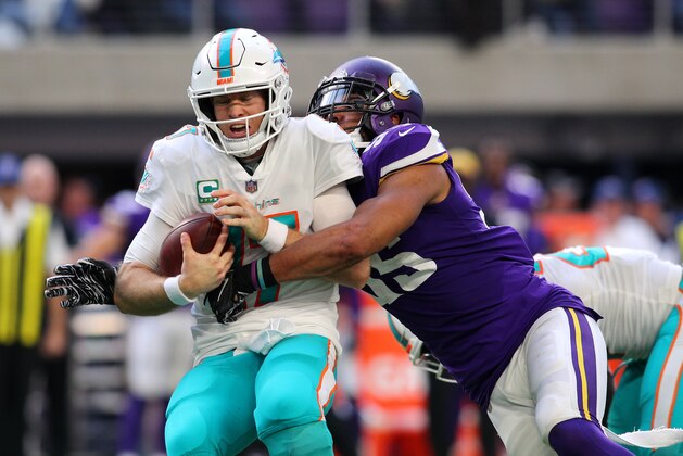 MINNEAPOLIS, MN - DECEMBER 16: Ryan Tannehill #17 of the Miami Dolphins is sacked with the ball by Anthony Barr #55 of the Minnesota Vikings in the third quarter of the game at U.S. Bank Stadium on December 16, 2018 in Minneapolis, Minnesota. (Photo by Adam Bettcher/Getty Images)
