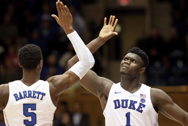 Duke's Zion Williamson (1) and RJ Barrett (5) high-five late in the second half of an NCAA college basketball game against Hartford in Durham, N.C., Wednesday, Dec. 5, 2018. (AP Photo/Ben McKeown)