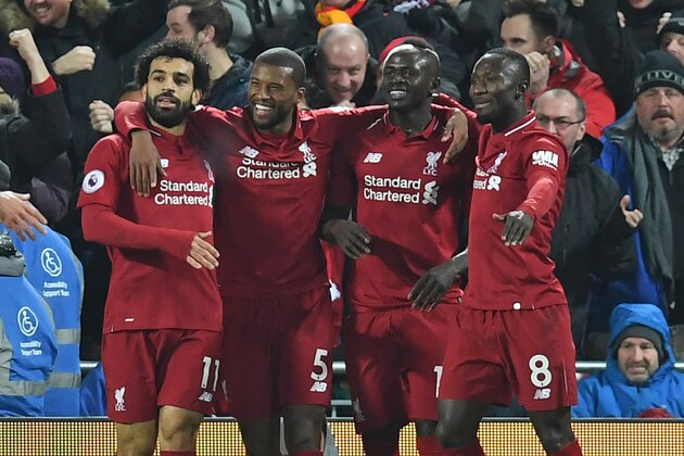 Liverpool's Senegalese striker Sadio Mane (2nd R) celebrates with teammates after scoring the opening goal of the English Premier League football match between Liverpool and Manchester United at Anfield in Liverpool, north west England on December 16, 2018. (Photo by Paul ELLIS / AFP) / RESTRICTED TO EDITORIAL USE. No use with unauthorized audio, video, data, fixture lists, club/league logos or 'live' services. Online in-match use limited to 120 images. An additional 40 images may be used in extra time. No video emulation. Social media in-match use limited to 120 images. An additional 40 images may be used in extra time. No use in betting publications, games or single club/league/player publications. /         (Photo credit should read PAUL ELLIS/AFP/Getty Images)