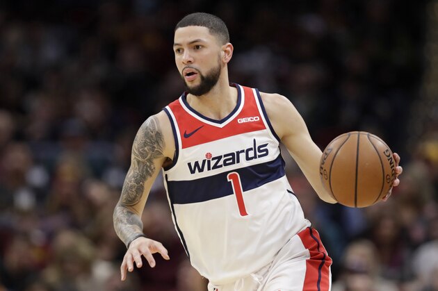 Washington Wizards' Austin Rivers drives to the basket in the second half of an NBA basketball game against the Cleveland Cavaliers, Saturday, Dec. 8, 2018, in Cleveland. (AP Photo/Tony Dejak)