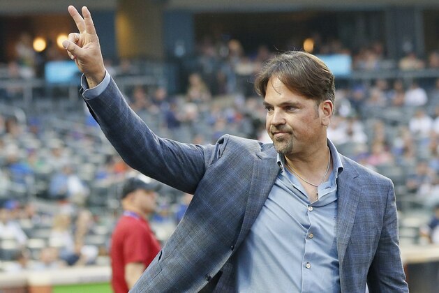 NEW YORK, NY - JUNE 09:  Former New York Mets catcher and Hall of Fame player Mike Piazza waves to fans by the dugout before an interleague MLB baseball game against the New York Yankees on June 9, 2018 at Citi Field in the Queens borough of New York City. Yankees won 4-3 . (Photo by Paul Bereswill/Getty Images)