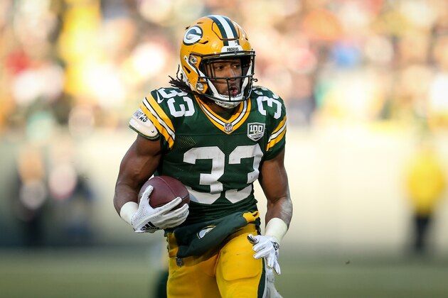 GREEN BAY, WISCONSIN - DECEMBER 09:  Aaron Jones #33 of the Green Bay Packers runs with the ball in the third quarter against the Atlanta Falcons at Lambeau Field on December 09, 2018 in Green Bay, Wisconsin. (Photo by Dylan Buell/Getty Images)