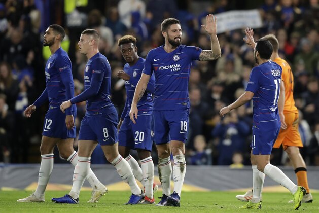 Chelsea's Oliver Giroud is congratulated by teammate Pedro Rodriguez, right, after scoring his second goal during the Europa League Group L soccer match between Chelsea and PAOK at Stamford Bridge stadium, in London, Thursday, Nov. 29, 2018. (AP Photo/Matt Dunham)