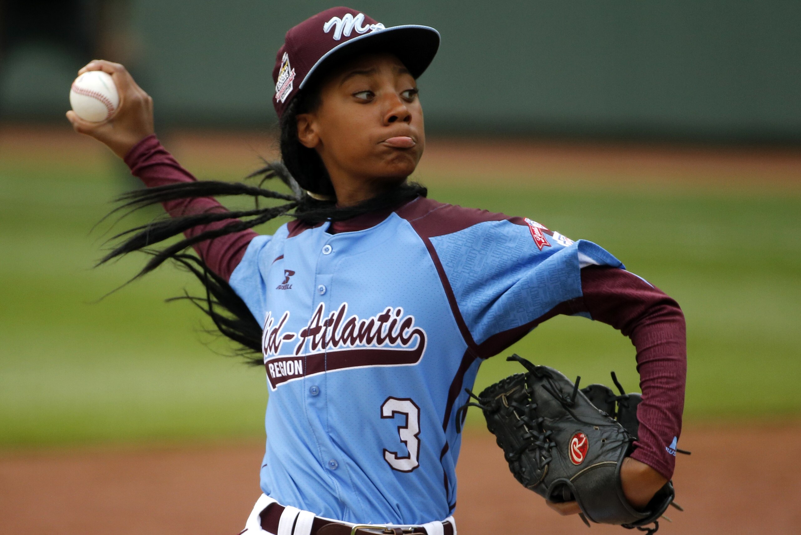 FILE - In this Aug. 15, 2014, file photo, Pennsylvania's  Mo'ne Davis delivers in the fifth inning against Tennessee during a baseball game at the Little League World Series tournament in South Williamsport, Pa. Davis was the talk of the sports world and beyond after becoming the first female to win a game in the Little League World Series. Her success has inspired other girls to pursue baseball, though no girls will be playing for the championship at Williamsport when the 16-team tournament starts Thursday. (AP Photo/Gene J. Puskar, File)