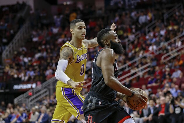 HOUSTON, TX - DECEMBER 13:  James Harden #13 of the Houston Rockets drives past Kyle Kuzma #0 of the Los Angeles Lakers during the second quarter at Toyota Center on December 13, 2018 in Houston, Texas. (Photo by Bob Levey/Getty Images)