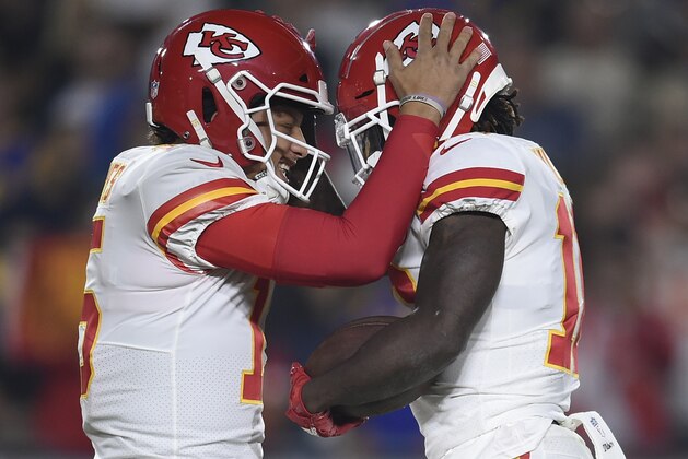ALTERNATE CROP - Kansas City Chiefs wide receiver Tyreek Hill, right, celebrates after he caught a pass for a touchdown from quarterback Patrick Mahomes, left, during the first half of an NFL football game against the Los Angeles Rams Monday, Nov. 19, 2018, in Los Angeles. (AP Photo/Kelvin Kuo)