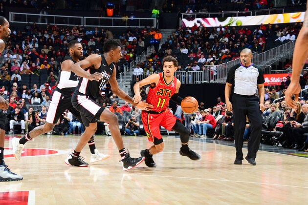 ATLANTA, GA - DECEMBER 18: Trae Young #11 of the Atlanta Hawks drives to the basket against the Washington Wizards on December 18, 2018 at State Farm Arena in Atlanta, Georgia.  NOTE TO USER: User expressly acknowledges and agrees that, by downloading and/or using this Photograph, user is consenting to the terms and conditions of the Getty Images License Agreement. Mandatory Copyright Notice: Copyright 2018 NBAE (Photo by Scott Cunningham/NBAE via Getty Images)