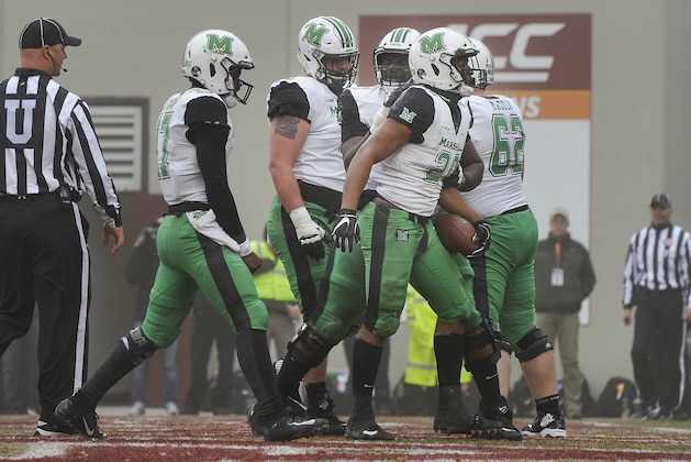 BLACKSBURG, VA - DECEMBER 1: Running back Brenden Knox #20 of the Marshall Thundering Herd celebrates his touchdown run against the Virginia Tech Hokies in the first half at Lane Stadium on December 1, 2018 in Blacksburg, Virginia. (Photo by Michael Shroyer/Getty Images)