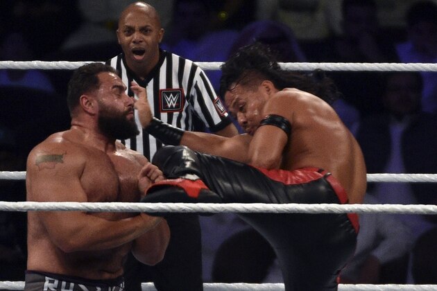 Shinsuke Nakamura (R) kicks Rusev (L) during the WWE United States Championship match as part of the World Wrestling Entertainment (WWE) Crown Jewel pay-per-view at the King Saud University Stadium in Riyadh on November 2, 2018. (Photo by Fayez Nureldine / AFP)        (Photo credit should read FAYEZ NURELDINE/AFP/Getty Images)