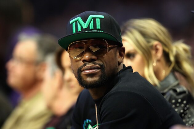 LOS ANGELES, CA - DECEMBER 17:  Boxer Floyd Mayweather looks on from the sidelines of a game between the Los Angeles Clippers and the Portland Trail Blazers  at Staples Center on December 17, 2018 in Los Angeles, California.  NOTE TO USER: User expressly acknowledges and agrees that, by downloading and or using this photograph, User is consenting to the terms and conditions of the Getty Images License Agreement  (Photo by Sean M. Haffey/Getty Images)