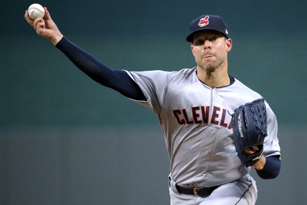 Cleveland Indians starting pitcher Corey Kluber throws during the first inning of a baseball game against the Kansas City Royals on Saturday, Sept. 29, 2018, in Kansas City, Mo. (AP Photo/Charlie Riedel)