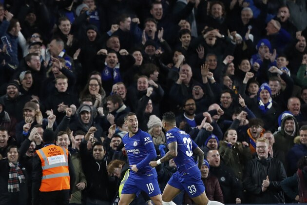 Chelsea's Eden Hazard, left celebrates after scoring his sides 1st goal with team mate Emerson during a League Cup, quarterfinal soccer match between Chelsea and Bournemouth at the Stamford Bridge stadium in London, Wednesday Dec. 19, 2018. (AP Photo/Alastair Grant)
