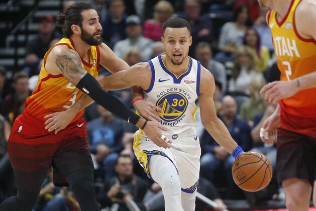 Utah Jazz guard Ricky Rubio, left, fouls Golden State Warriors guard Stephen Curry (30) as he drives up court in the first half during an NBA basketball game Wednesday Dec. 19, 2018, in Salt Lake City. (AP Photo/Rick Bowmer)