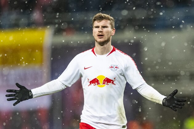 Leipzig's German forward Timo Werner celebrates scoring the fourth goal during the German first division Bundesliga football match between RB Leipzig and FSV Mainz in Leipzig, eastern Germany on December 16, 2018. (Photo by ROBERT MICHAEL / AFP) / DFL REGULATIONS PROHIBIT ANY USE OF PHOTOGRAPHS AS IMAGE SEQUENCES AND/OR QUASI-VIDEO        (Photo credit should read ROBERT MICHAEL/AFP/Getty Images)