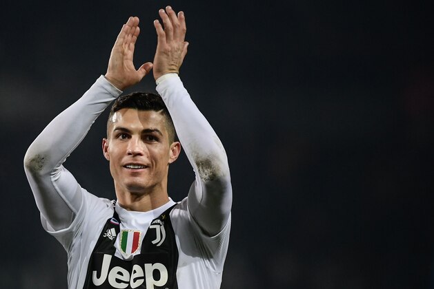 Juventus' Portuguese forward Cristiano Ronaldo applauds at the end of the Italian Serie A football match Torino vs Juventus on December 15, 2018 at the Olympic stadium in Turin. (Photo by Marco BERTORELLO / AFP)        (Photo credit should read MARCO BERTORELLO/AFP/Getty Images)
