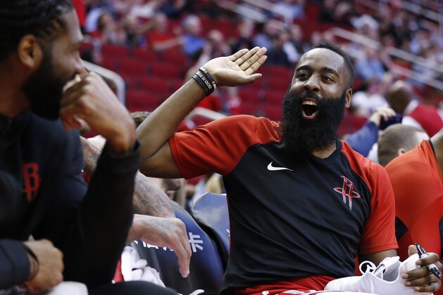 HOUSTON, TEXAS - DECEMBER 19: James Harden #13 of the Houston Rockets smiles from the bench area during the fourth quarter against the Washington Wizards at Toyota Center on December 19, 2018 in Houston, Texas. NOTE TO USER: User expressly acknowledges and agrees that, by downloading and or using this photograph, User is consenting to the terms and conditions of the Getty Images License Agreement. (Photo by Bob Levey/Getty Images)