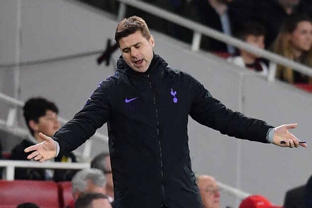 Tottenham Hotspur's Argentinian head coach Mauricio Pochettino reacts during the English League Cup quarter-final football match between Arsenal and Tottenham Hotspur at the Emirates Stadium in London on December 19, 2018. (Photo by Ben STANSALL / AFP) / RESTRICTED TO EDITORIAL USE. No use with unauthorized audio, video, data, fixture lists, club/league logos or 'live' services. Online in-match use limited to 120 images. An additional 40 images may be used in extra time. No video emulation. Social media in-match use limited to 120 images. An additional 40 images may be used in extra time. No use in betting publications, games or single club/league/player publications. /         (Photo credit should read BEN STANSALL/AFP/Getty Images)