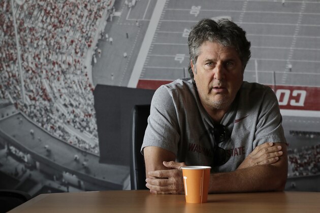 Washington State head coach Mike Leach listens to a question during an interview before NCAA college football practice, Thursday, Aug. 16, 2018, in Pullman, Wash. WSU finished 9-4 last season, winning all seven of their home games, but they stumbled in their final two games, losing to cross-state rival Washington and getting beat by Michigan State in the Holiday Bowl. (AP Photo/Ted S. Warren)
