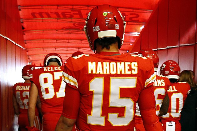 KANSAS CITY, MISSOURI - DECEMBER 13:  Quarterback Patrick Mahomes #15 of the Kansas City Chiefs prepares to run onto the field during player introductions prior to the game against the Los Angeles Chargers at Arrowhead Stadium on December 13, 2018 in Kansas City, Missouri. (Photo by Jamie Squire/Getty Images)