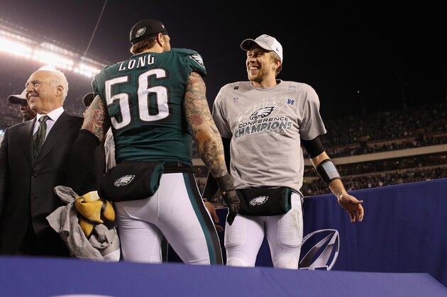 PHILADELPHIA, PA - JANUARY 21: Chris Long #56 and Nick Foles #9 of the Philadelphia Eagles celebrate their teams win over the Minnesota Vikings in the NFC Championship game at Lincoln Financial Field on January 21, 2018 in Philadelphia, Pennsylvania. The Philadelphia Eagles defeated the Minnesota Vikings 38-7.  (Photo by Patrick Smith/Getty Images)