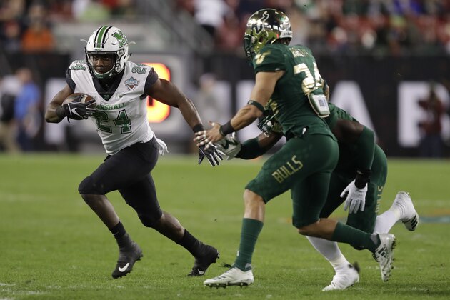 Marshall running back Keion Davis (24) runs against South Florida during the first half of the Gasparilla Bowl NCAA college football game Thursday, Dec. 20, 2018, in Tampa, Fla. (AP Photo/Chris O'Meara)