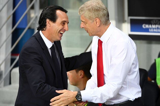 Paris Saint-Germain's Spanish head coach Unai Emery (L) shakes hands with Arsenal's French manager Arsene Wenger during the UEFA Champions League Group A football match between Paris-Saint-Germain and Arsenal FC on September 13, 2016 at the Parc des Princes stadium in Paris.  / AFP / FRANCK FIFE        (Photo credit should read FRANCK FIFE/AFP/Getty Images)