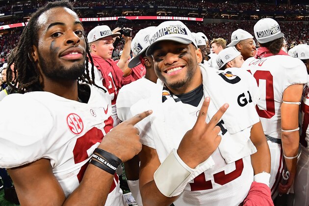 ATLANTA, GA - DECEMBER 01:  Tua Tagovailoa #13 of the Alabama Crimson Tide (R) reacts after defeating the Georgia Bulldogs 35-28 in the 2018 SEC Championship Game at Mercedes-Benz Stadium on December 1, 2018 in Atlanta, Georgia.  (Photo by Scott Cunningham/Getty Images)