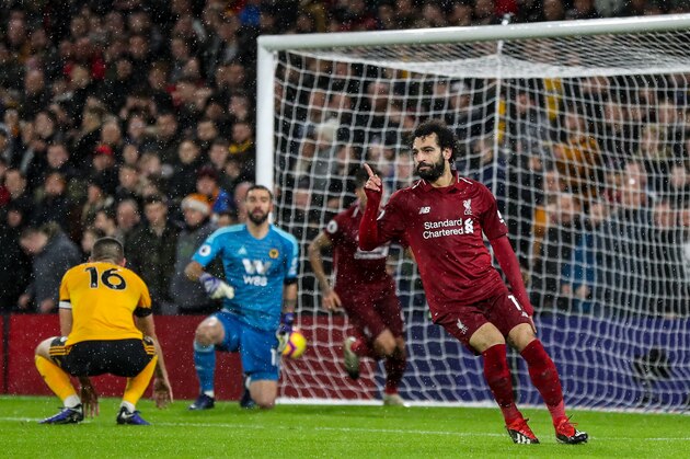 WOLVERHAMPTON, ENGLAND - DECEMBER 21: Mohamed Salah of Liverpool celebrates after scoring a goal to make it 0-1 during the Premier League match between Wolverhampton Wanderers and Liverpool FC at Molineux on December 21, 2018 in Wolverhampton, United Kingdom. (Photo by James Baylis - AMA/Getty Images)