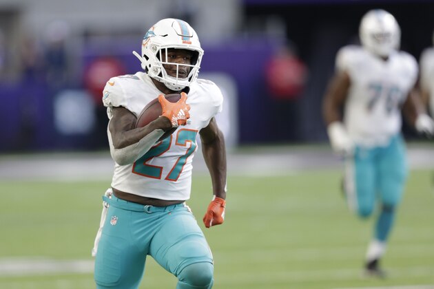 Miami Dolphins running back Kalen Ballage runs up field during a 75-yard touchdown run in the second half of an NFL football game against the Minnesota Vikings, Sunday, Dec. 16, 2018, in Minneapolis. (AP Photo/Andy Clayton-King)