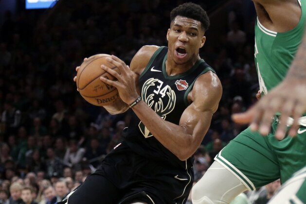 Milwaukee Bucks forward Giannis Antetokounmpo (34) drives to the hoop in the second quarter of an NBA basketball game against the Boston Celtics, Friday, Dec. 21, 2018, in Boston. (AP Photo/Elise Amendola)