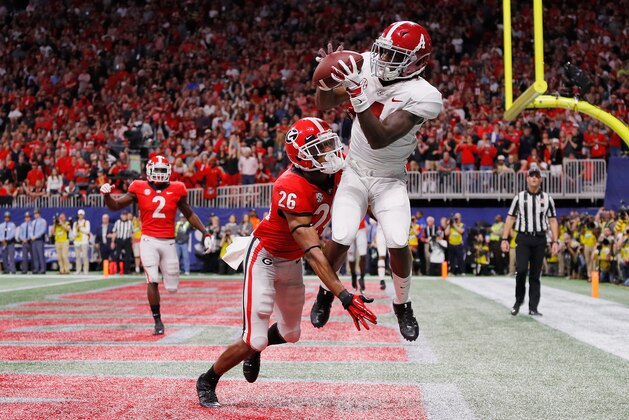 ATLANTA, GA - DECEMBER 01:  Jerry Jeudy #4 of the Alabama Crimson Tide catches a touchdown pass against Tyrique McGhee #26 of the Georgia Bulldogs in the fourth quarter during the 2018 SEC Championship Game at Mercedes-Benz Stadium on December 1, 2018 in Atlanta, Georgia.  (Photo by Kevin C. Cox/Getty Images)