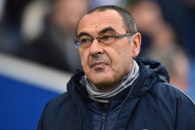 Chelsea's Italian head coach Maurizio Sarri arrives for the English Premier League football match between Brighton and Hove Albion and Chelsea at the American Express Community Stadium in Brighton, southern England on December 16, 2018. (Photo by Glyn KIRK / AFP) / RESTRICTED TO EDITORIAL USE. No use with unauthorized audio, video, data, fixture lists, club/league logos or 'live' services. Online in-match use limited to 120 images. An additional 40 images may be used in extra time. No video emulation. Social media in-match use limited to 120 images. An additional 40 images may be used in extra time. No use in betting publications, games or single club/league/player publications. /         (Photo credit should read GLYN KIRK/AFP/Getty Images)