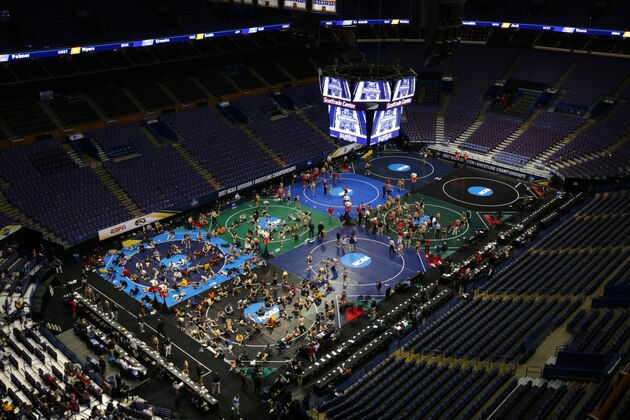 ST. LOUIS, MO - MARCH 17: Wrestlers gather on the mats for skin checks and weigh-ins before session three of the NCAA Wrestling Championships on March 17, 2017 at the Scottrade Center in St. Louis, Missouri. (Photo by Hunter Martin/Getty Images)