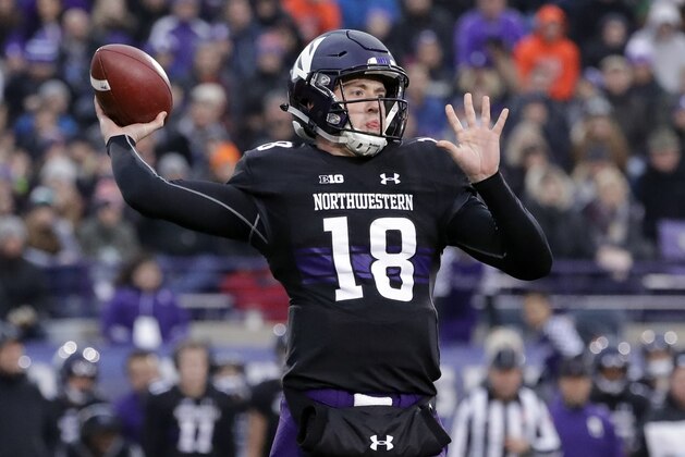 Northwestern quarterback Clayton Thorson looks to pass during the first half of an NCAA college football game against Illinois, Saturday, Nov. 24, 2018, in Evanston, Ill. Northwestern won 24-16. (AP Photo/Nam Y. Huh)