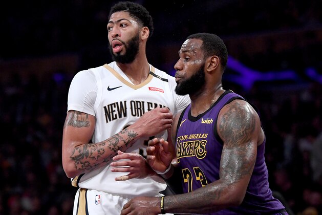 LOS ANGELES, CALIFORNIA - DECEMBER 21:  LeBron James #23 of the Los Angeles Lakers guards Anthony Davis #23 of the New Orleans Pelicans during a 112-104 Laker win at Staples Center on December 21, 2018 in Los Angeles, California.  NOTE TO USER: User expressly acknowledges and agrees that, by downloading and or using this photograph, User is consenting to the terms and conditions of the Getty Images License Agreement. (Photo by Harry How/Getty Images)