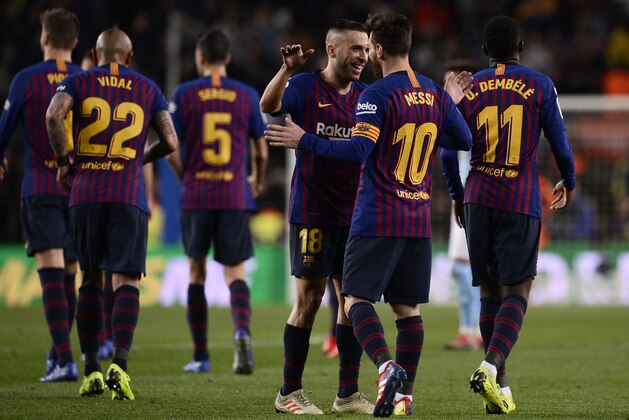 Barcelona's Argentinian forward Lionel Messi (2R) celebrates a goal with Barcelona's Spanish defender Jordi Alba during the Spanish League football match between FC Barcelona and RC Celta de Vigo at the Camp Nou stadium in Barcelona on Decemeber 22, 2018. (Photo by Josep LAGO / AFP)        (Photo credit should read JOSEP LAGO/AFP/Getty Images)
