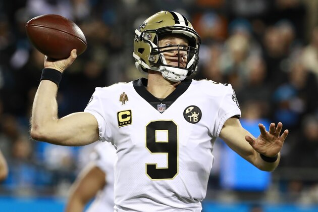 FILE - In this Dec. 17, 2018 file photo New Orleans Saints' Drew Brees (9) looks to pass against the Carolina Panthers in the first half of an NFL football game in Charlotte, N.C. Brees is the starting quarterback for the NFC backed by Green Bay’s Aaron Rodgers and the Rams’ Jared Goff for the Pro Bowl which will be played Jan. 27 in Orlando. (AP Photo/Jason E. Miczek, file)