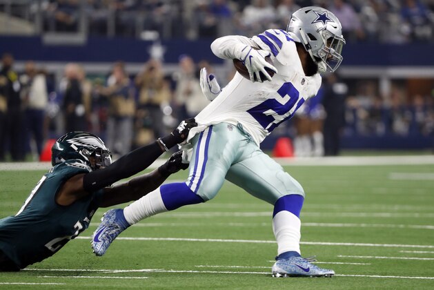 Dallas Cowboys running back Ezekiel Elliott (21) is stopped by Philadelphia Eagles linebacker Nate Gerry (47) during the first half of an NFL football game, in Arlington, Texas, Sunday, Dec. 9, 2018. (AP Photo/Tony Gutierrez)
