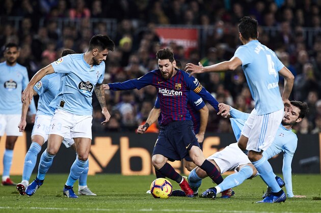 BARCELONA, SPAIN - DECEMBER 22: Lionel Messi of FC Barcelona surrounded by 5 Celta de Vigo players  during the La Liga match between FC Barcelona and RC Celta de Vigo at Camp Nou on December 22, 2018 in Barcelona, Spain. (Photo by Quality Sport Images/Getty Images)