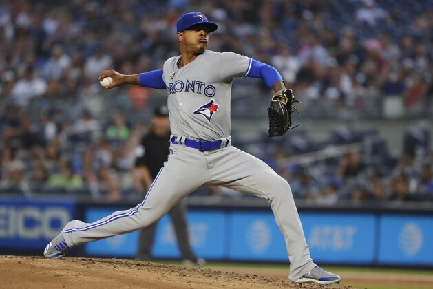Toronto Blue Jays' Marcus Stroman delivers a pitch during the first inning of a baseball game against the New York Yankees, Friday, Aug. 17, 2018, in New York. (AP Photo/Frank Franklin II)