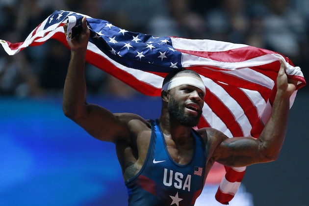 USA's Jordan Burroughs celebrates after winning the men's freestyle wrestling -74kg category final at the FILA World Wrestling Championships in Paris on August 26, 2017. / AFP PHOTO / BENJAMIN CREMEL        (Photo credit should read BENJAMIN CREMEL/AFP/Getty Images)