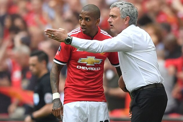 Manchester United's Portuguese manager Jose Mourinho (R) has words with Manchester United's English midfielder Ashley Young (L) on the touchline during the English FA Cup semi-final football match between Tottenham Hotspur and Manchester United at Wembley Stadium in London, on April 21, 2018. (Photo by Ben STANSALL / AFP) / NOT FOR MARKETING OR ADVERTISING USE / RESTRICTED TO EDITORIAL USE        (Photo credit should read BEN STANSALL/AFP/Getty Images)