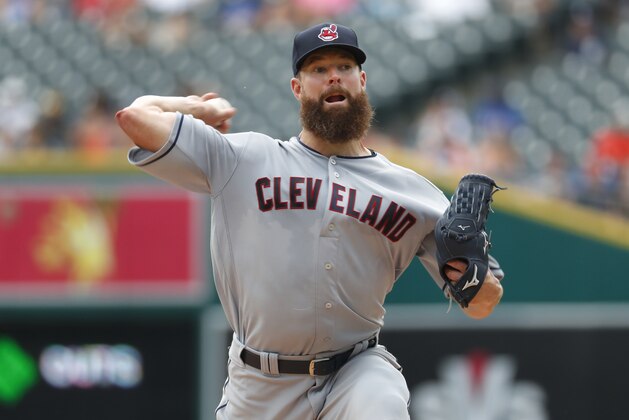Cleveland Indians pitcher Corey Kluber throws against the Detroit Tigers in the first inning of a baseball game in Detroit, Sunday, July 29, 2018. (AP Photo/Paul Sancya)