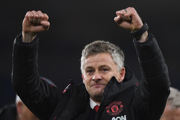 CARDIFF, WALES - DECEMBER 22:  Ole Gunnar Solskjaer, Interim Manager of Manchester United celebrates with the fans after the Premier League match between Cardiff City and Manchester United at Cardiff City Stadium on December 22, 2018 in Cardiff, United Kingdom.  (Photo by Stu Forster/Getty Images)