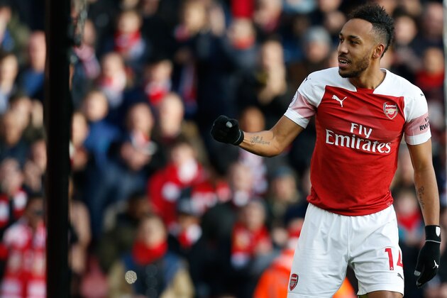 Arsenal's Gabonese striker Pierre-Emerick Aubameyang celebrates after scoring their second goal during the English Premier League football match between Arsenal and Burnley at the Emirates Stadium in London on December 22, 2018. (Photo by Ian KINGTON / AFP) / RESTRICTED TO EDITORIAL USE. No use with unauthorized audio, video, data, fixture lists, club/league logos or 'live' services. Online in-match use limited to 120 images. An additional 40 images may be used in extra time. No video emulation. Social media in-match use limited to 120 images. An additional 40 images may be used in extra time. No use in betting publications, games or single club/league/player publications. /         (Photo credit should read IAN KINGTON/AFP/Getty Images)