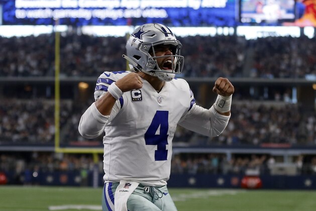 Dallas Cowboys quarterback Dak Prescott (4) celebrates scoring a touchdown on a running play in the first half of an NFL football game against the Tampa Bay Buccaneers in Arlington, Texas, Sunday, Dec. 23, 2018. (AP Photo/Ron Jenkins)