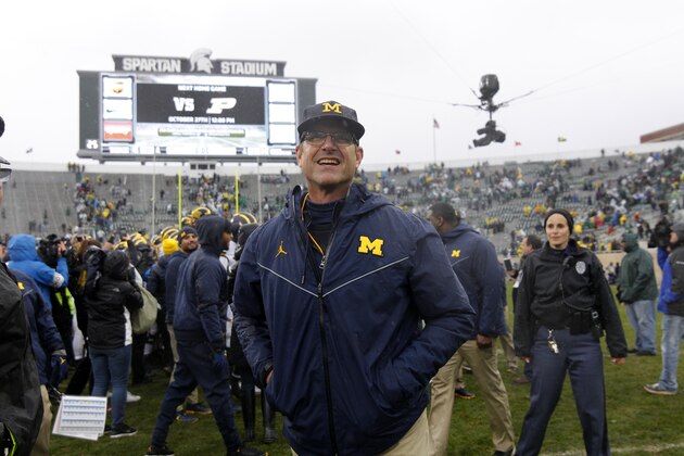 Michigan coach Jim Harbaugh reacts following a 21-7 win over Michigan State in an NCAA college football game, Saturday, Oct. 20, 2018, in East Lansing, Mich. (AP Photo/Al Goldis)
