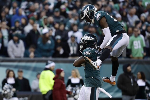 Philadelphia Eagles' LaRoy Reynolds, left, and Deiondre' Hall celebrate after a defensive stop during the second half of an NFL football game against the Houston Texans, Sunday, Dec. 23, 2018, in Philadelphia. (AP Photo/Matt Rourke)