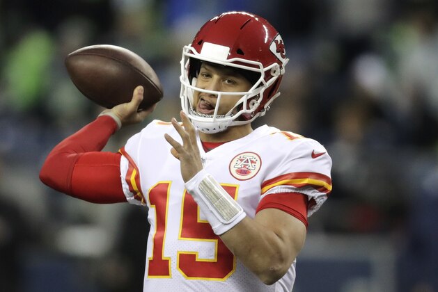 Kansas City Chiefs quarterback Patrick Mahomes passes during warmups before an NFL football game against the Seattle Seahawks, Sunday, Dec. 23, 2018, in Seattle. (AP Photo/Stephen Brashear)